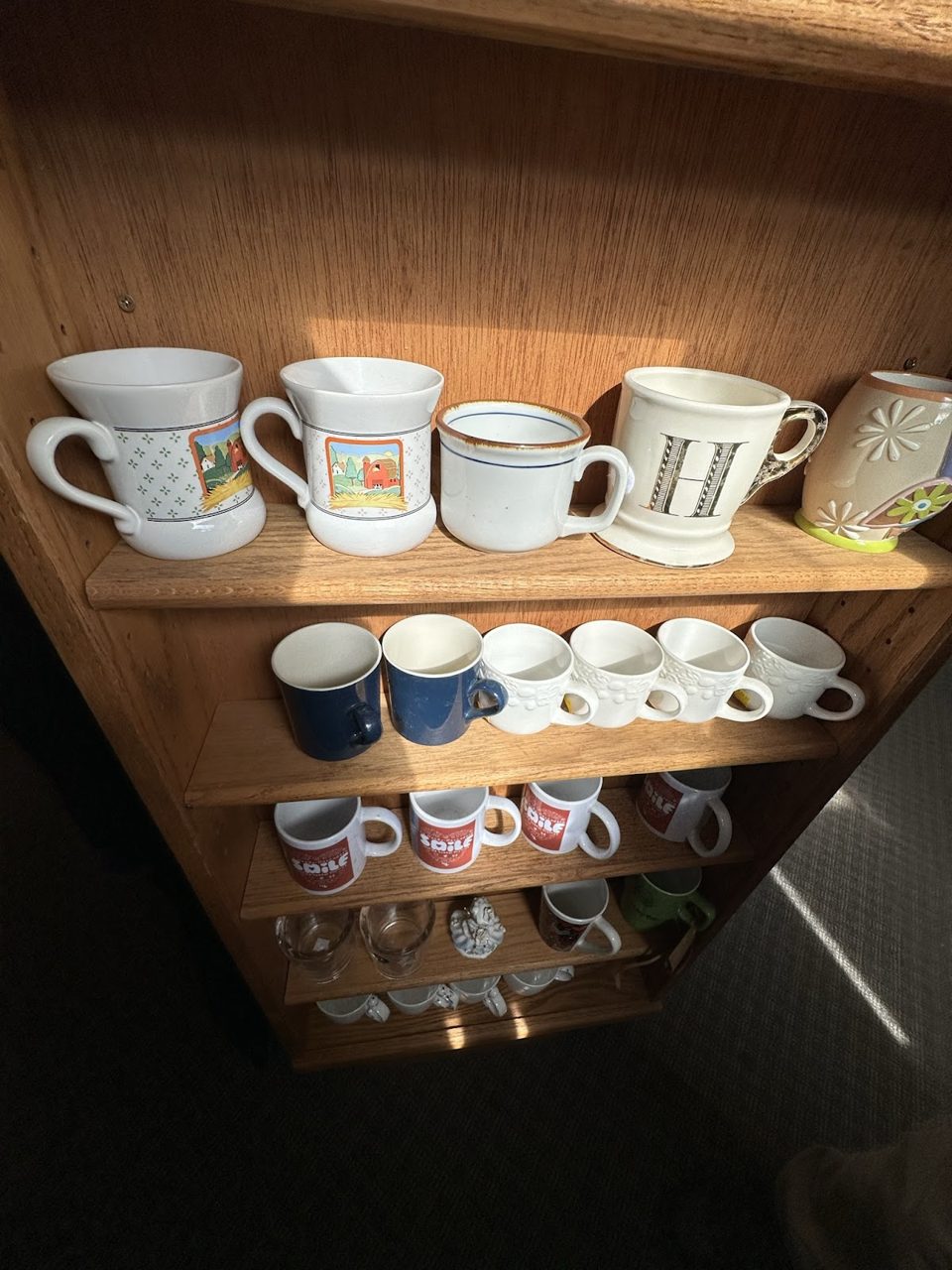 Shelf of mugs and housewares