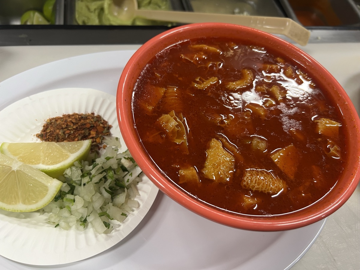 Menudo — slow-cooked tripe in red broth