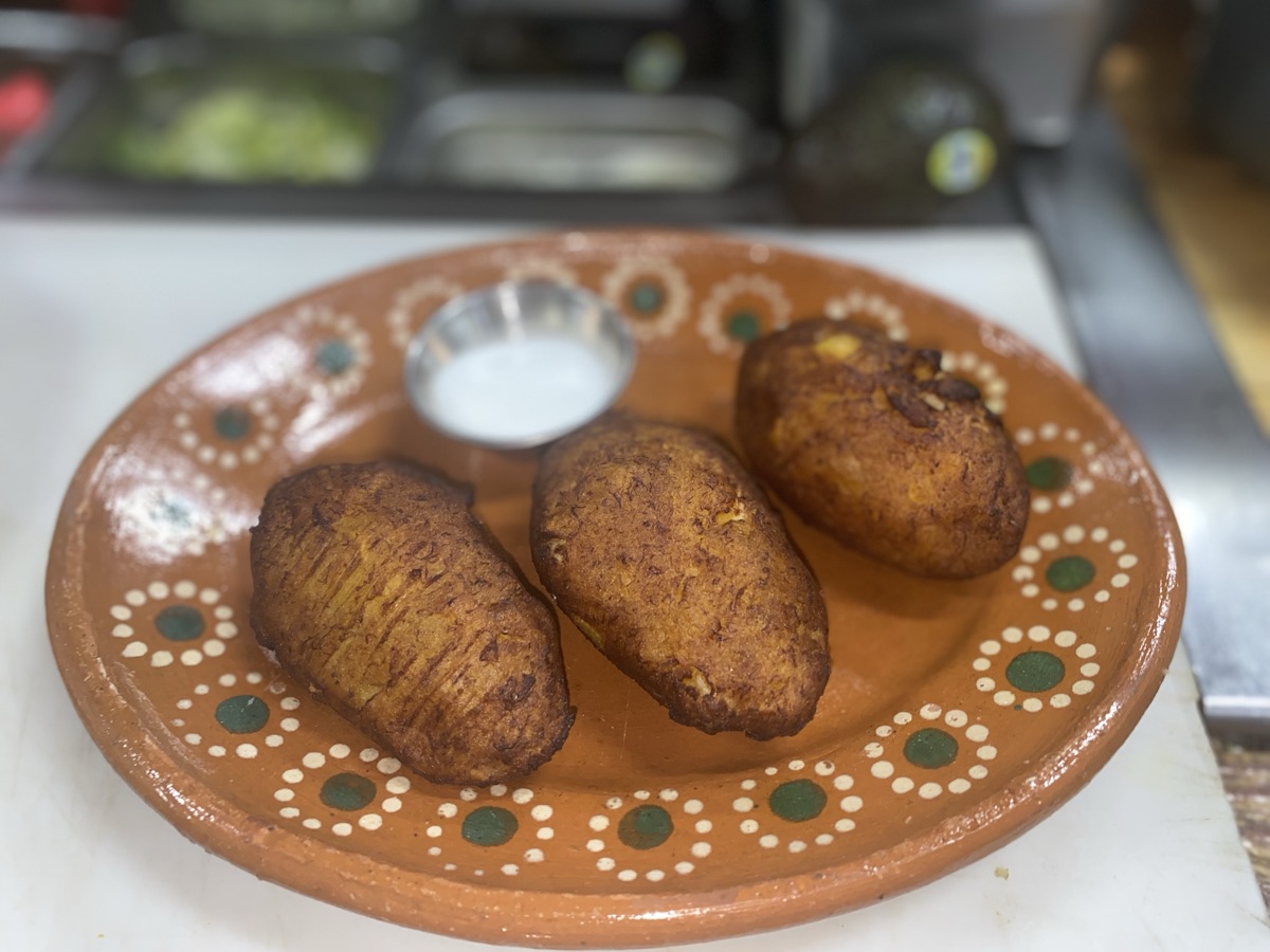 Pasteles de pollo — fresh-made chicken pies, crisp-fried