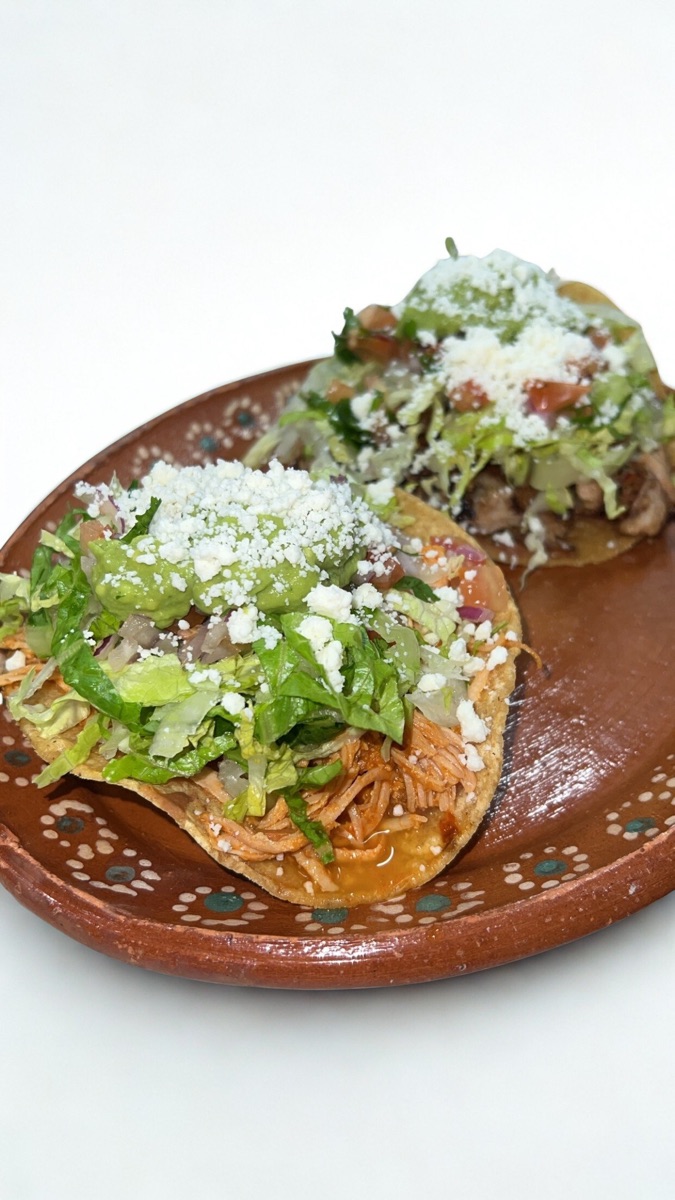 Chicken tostadas with crema and queso fresco
