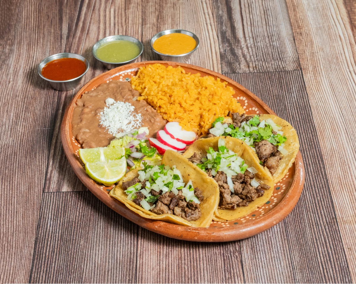 Taco Plate Special — three tacos with rice & beans